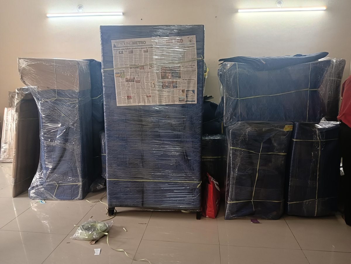 Professional multi-layer stretch film and blanket wrapping for safe household shifting by National Packers and Movers